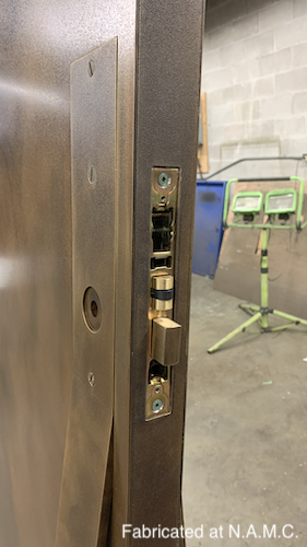 Large Brass Cladded Door Close Up
